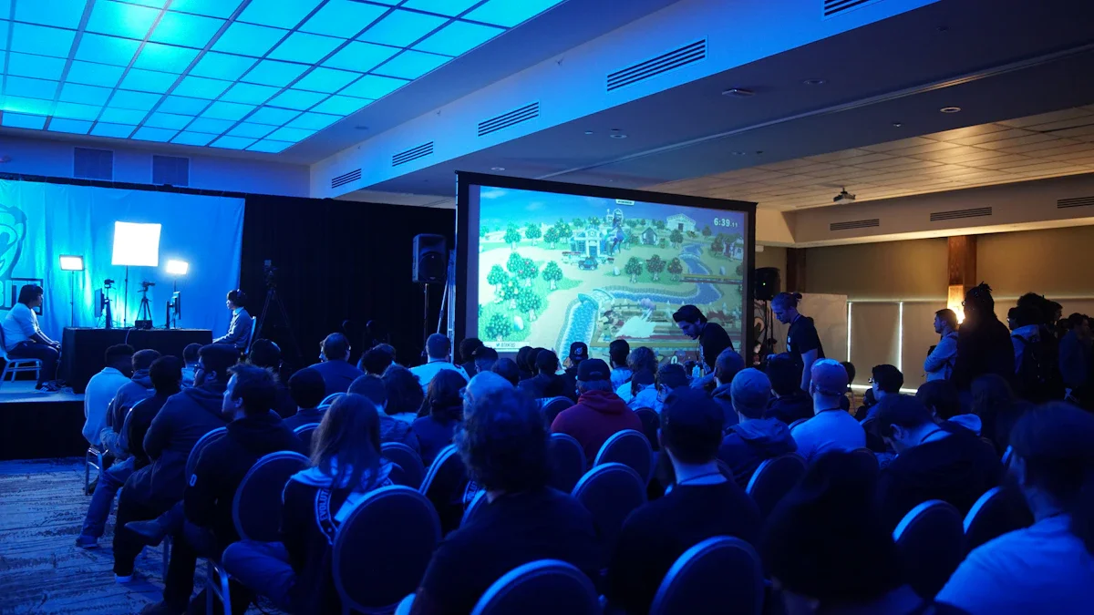 Une conférence sur le gaming et la technologie avec un public attentif devant un grand écran.